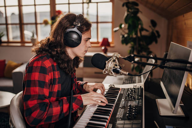 istock Male artist making music in recording studio 1301070894