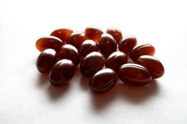 lecytyna suplement diety - lecithin capsule brown vitamin pill zdjęcia i obrazy z banku zdjęć