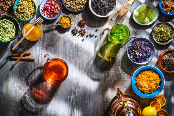 istock Tea and herbal infusion with dried herbs on wooden gray table board 1301071200