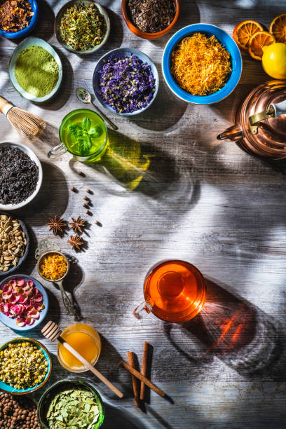 istock Tea and herbal infusion with dried herbs on wooden gray table board 1301071353