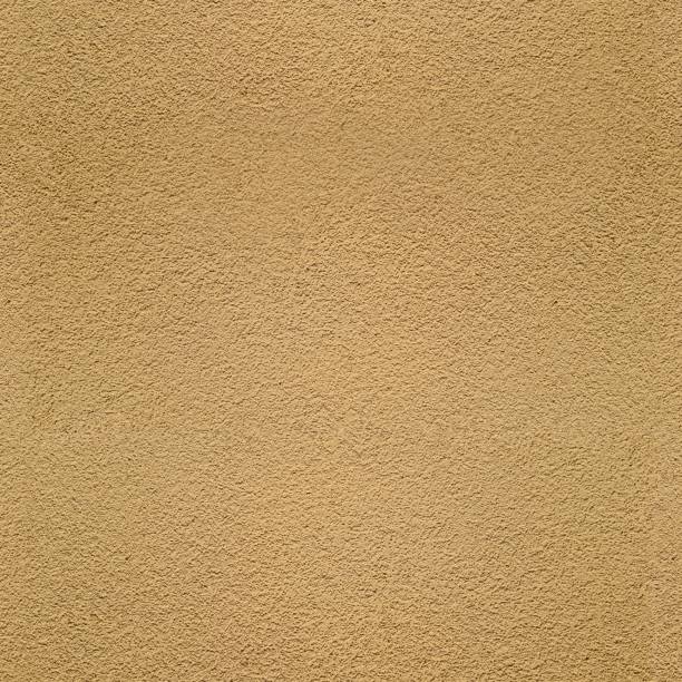 Sand texture seamless background in light yellow color stock photo