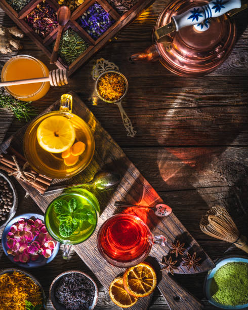 istock Tea and herbal infusion with dried herbs on wooden rustic table board 1301071543