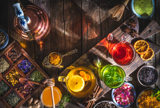 istock Tea and herbal infusion with dried herbs on wooden rustic table board 1301072162