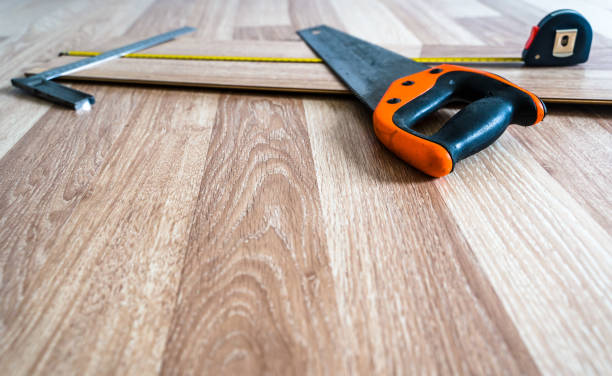 istock Construction Tools Lying on Wooden Floor Boards for Work. Abstract Renovation and Reconstruction Background with Selective Focus and Copy Space 1301072292