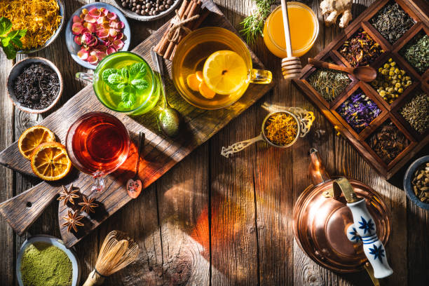 istock Tea and herbal infusion with dried herbs on wooden rustic table board 1301072449