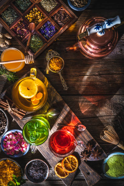 istock Tea and herbal infusion with dried herbs on wooden rustic table board 1301072554