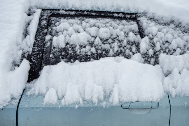 istock The car door is covered with snow 1301074587
