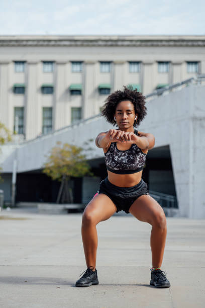 istock Afro athletic woman doing exercise outdoors. 1301075760