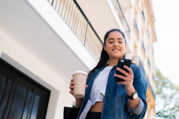 istock Young woman using her mobile phone. 1301075808