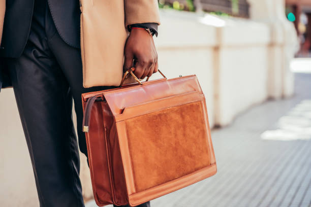 istock Business man holding a briefcase. 1301075822