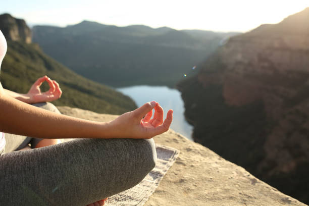 istock Woman hands practicing yoga in the mountain 1301075963