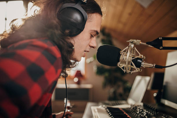 istock Male artist making music in recording studio 1301076005
