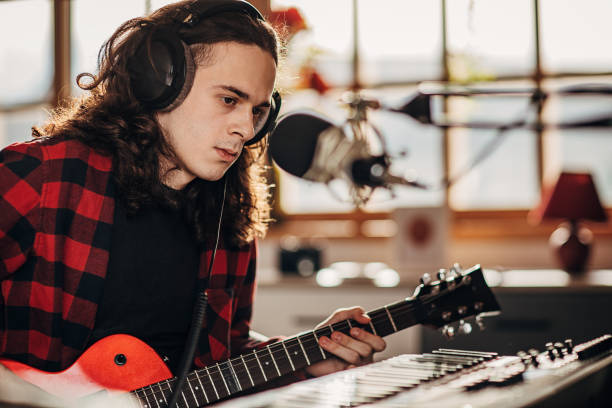istock Male artist making music in recording studio 1301076086