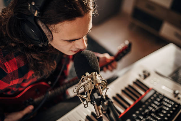 istock Male artist making music in recording studio 1301076103