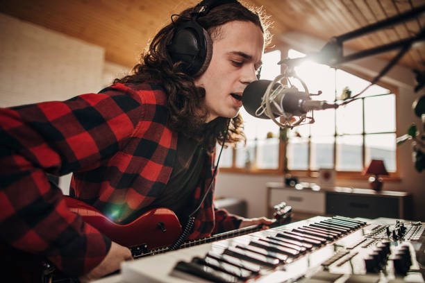 istock Male artist making music in recording studio 1301076189