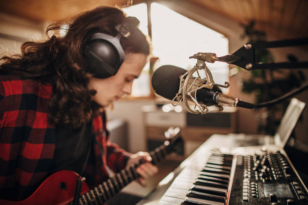 istock Male artist making music in recording studio 1301076306