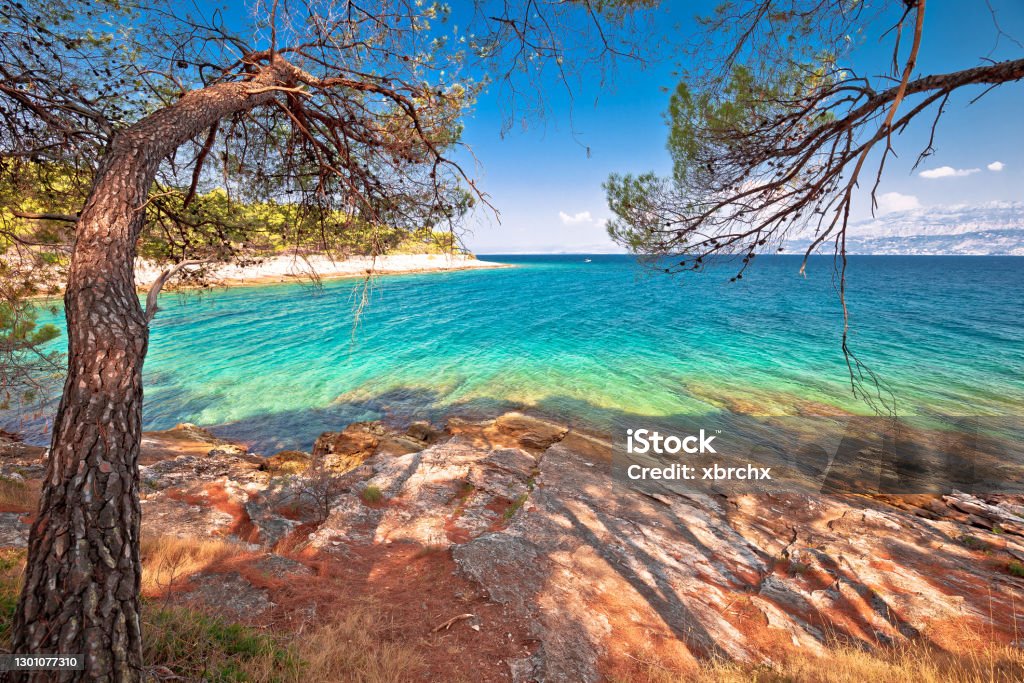 Amazing turquoise stone beach on Brac island view Amazing turquoise stone beach on Brac island view, archipelago of Dalmatia, Croatia Bol - Croatia Stock Photo