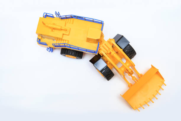 istock Scale model of a yellow single-bucket loader on white background 1301079003
