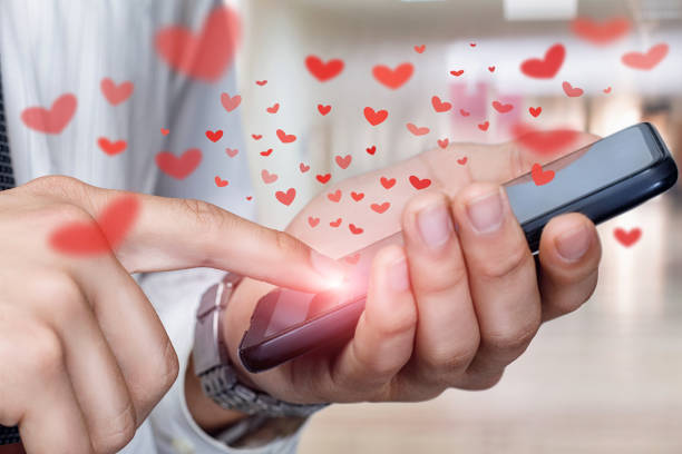 istock Concept of happy valentines day using mobile . 1301081759