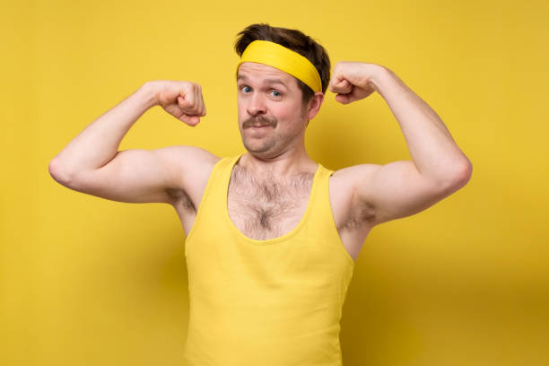 istock Young man showing arms muscles smiling being proud. 1301081937