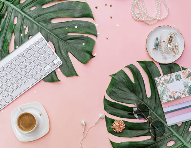 istock Modern flat lay  feminine workspace with stationery, Accessory on the pink table. Tropical View top. Still life scene 1301084979