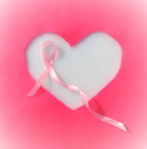 cinta rosa en marco del corazón, mes de conciencia: cáncer de mama - breast cancer awareness fotografías e imágenes de stock