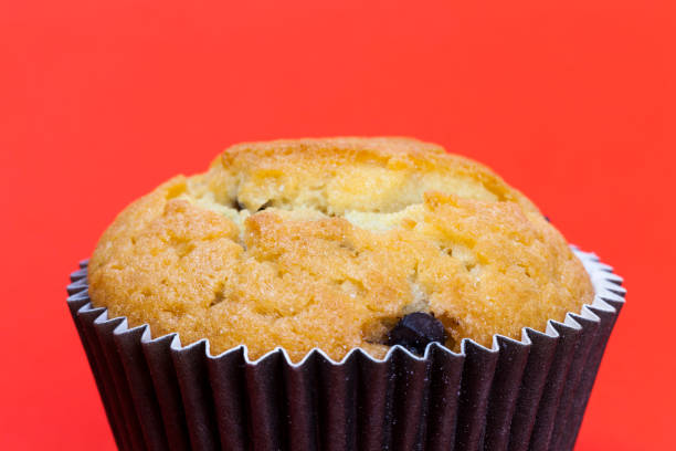 wheat sweet cupcake fresh and soft, dessert cupcake, made from flour, sugar and other ingredients, cupcake without people ready to eat,red background