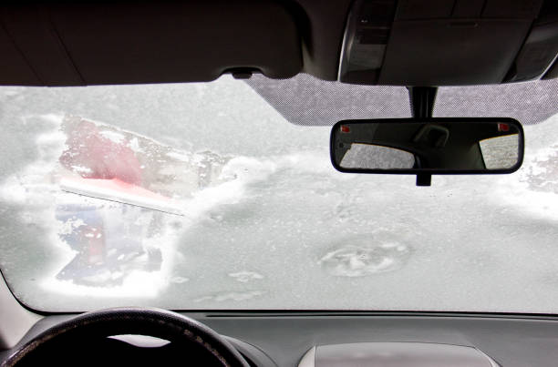 istock Cleaning car after snow storm 1301087118