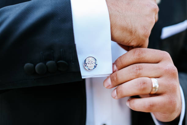 istock Groom wearing a boutonniere at his wedding 1301088428
