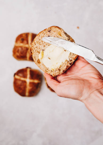 istock Traditional Easter Hot Cross Buns With raisins, jam and butter 1301089682