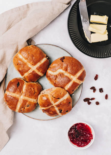 istock Traditional Easter Hot Cross Buns With raisins, jam and butter 1301090272
