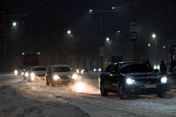 istock city traffic during heavy snowfall in the evening 1301091191