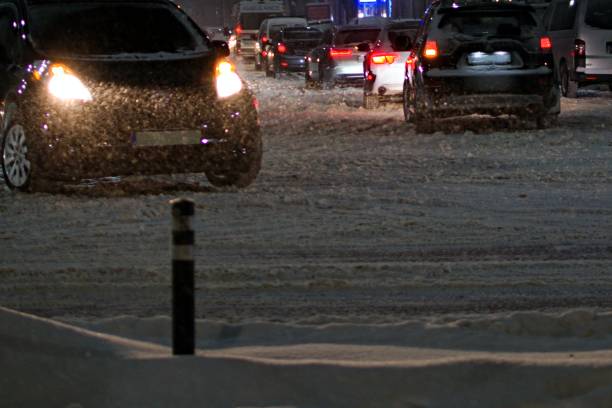 istock city traffic during heavy snowfall in the evening 1301091202