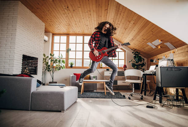 istock Male guitarist playing electric guitar 1301091548