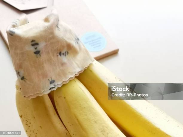 Use Of Beeswax Cloth As Alternative To Traditional Plastic Wrap In Order To Keep Bananas Fresh Stock Photo - Download Image Now