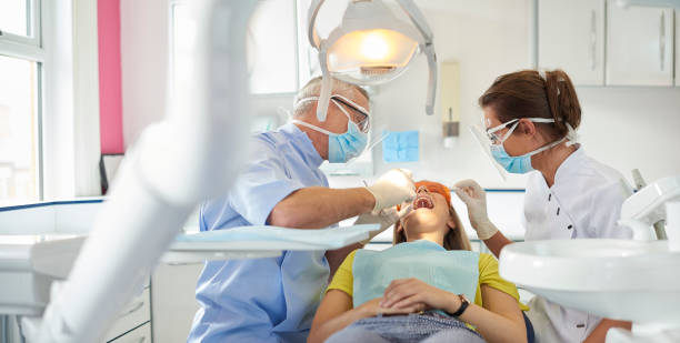 istock dentist team wearing covid ppe 1301093484