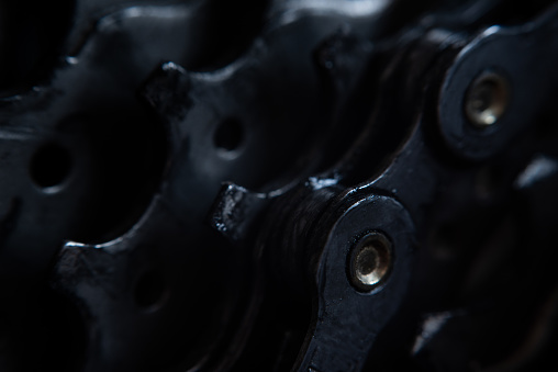 Detail of bicycle chain in a dark / low light environment