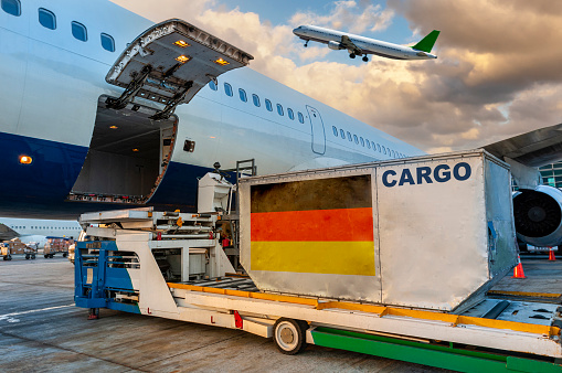 Loading the container in the cargo airplane.