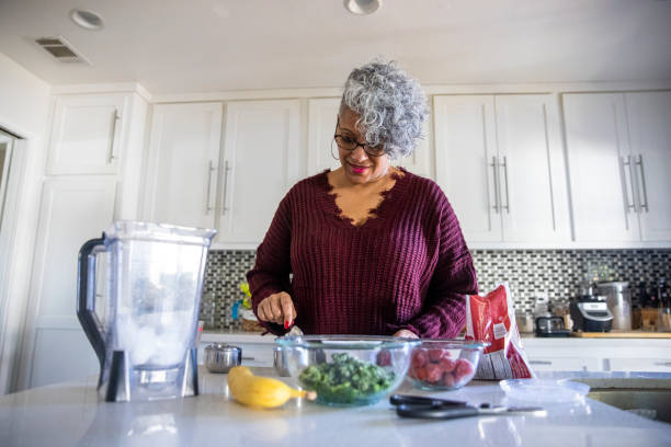 istock Beautiful Black Woman Having a Smoothie 1301101751
