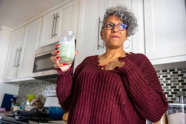 istock Beautiful Black Woman Having a Smoothie 1301101772