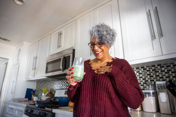 istock Beautiful Black Woman Having a Smoothie 1301101807