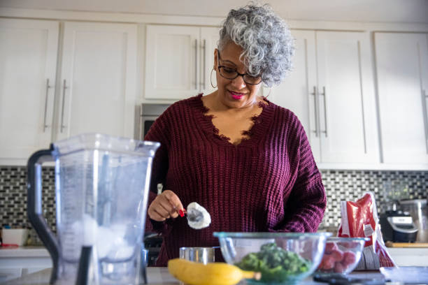 istock Beautiful Black Woman Having a Smoothie 1301101866