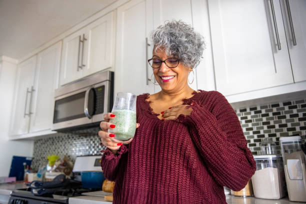 istock Beautiful Black Woman Having a Smoothie 1301102050