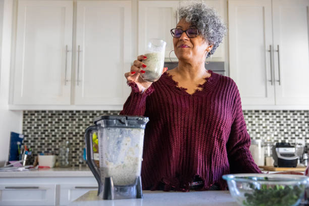 istock Beautiful Black Woman Having a Smoothie 1301102097