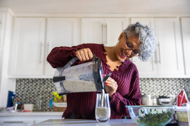 istock Beautiful Black Woman Having a Smoothie 1301102111