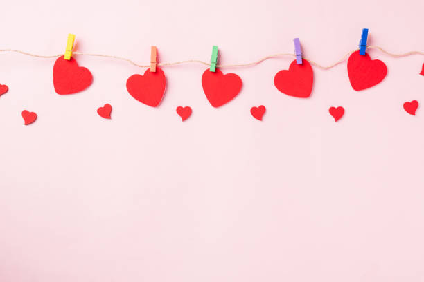 istock red heart shaped valentines decoration hanging with paper clips 1301102834