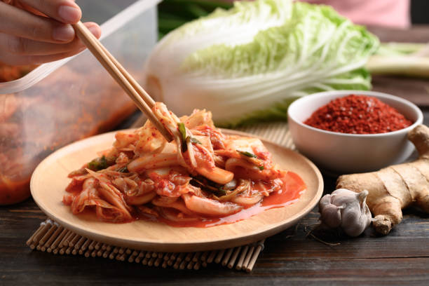 istock Korean food, Kimchi cabbage eating by chopsticks 1301107186