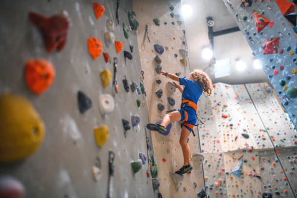 istock Young Man and Woman Preparing Climbing Ropes for Workout 1301107385