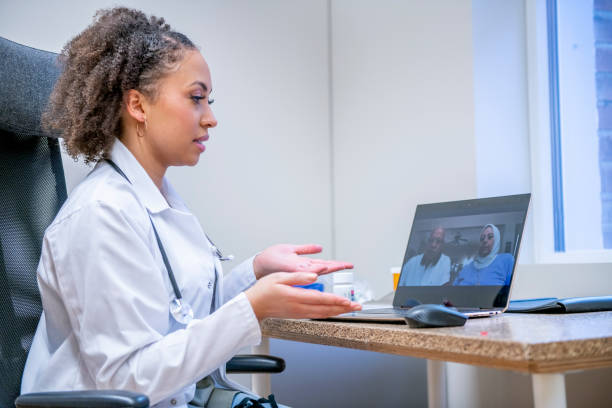 istock Female doctor meeting with patients virtually 1301107945
