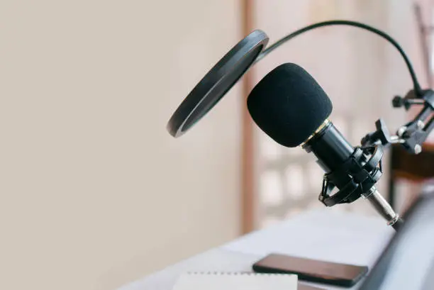 close up microphone set production on table in the recoding studio for podcast broadcast communication lifestyle concept